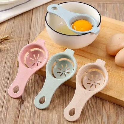 Pastel-colored plastic egg white separator with star-shaped perforated design for easy egg white separation