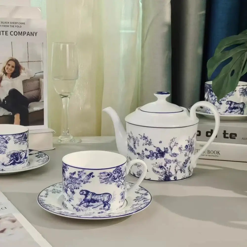 White ceramic teapot with blue floral and tiger motifs from decorbites jungle lion bone tea set porcelain collection