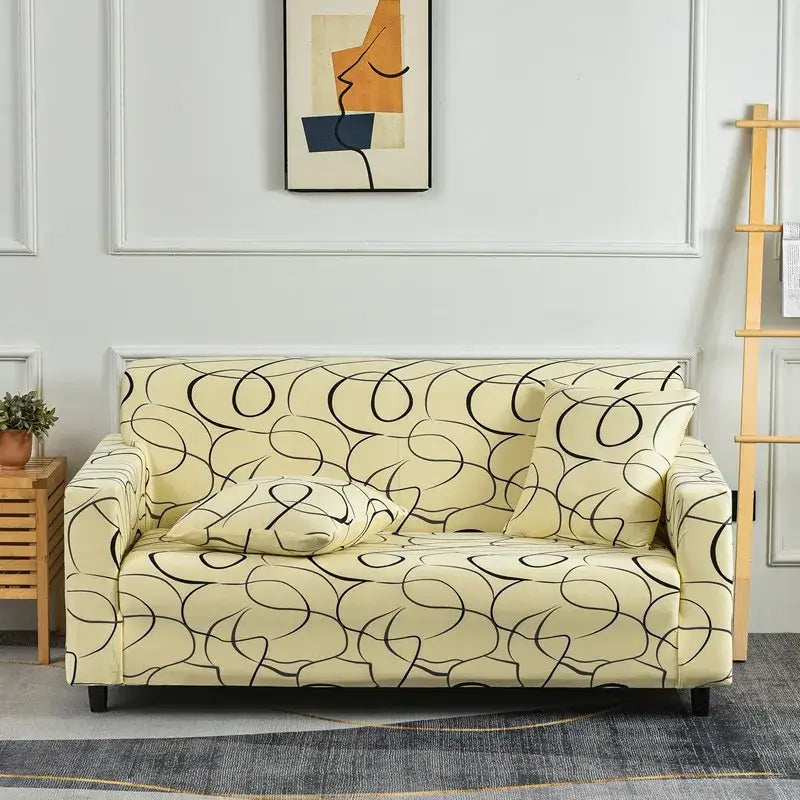 Cream-colored stretch sofa cover with black abstract swirl patchwork mandala print for living room slipcover use