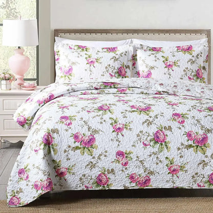White quilted coverlet bedding set with pink rose floral pattern and green foliage featuring soft textured surface