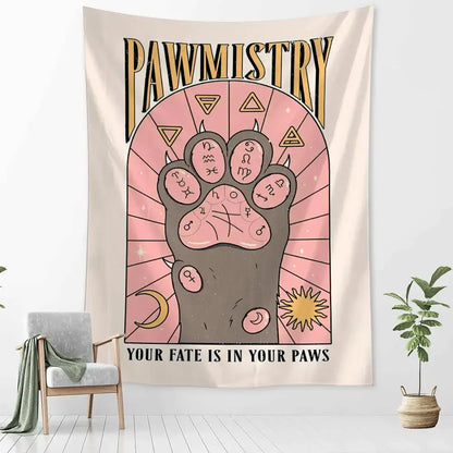 A beige wall tapestry featuring a stylized cartoon cat claw paw print with astrological symbols for bedroom decor