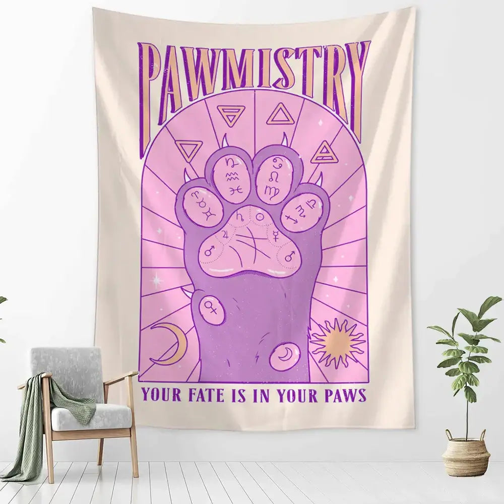A cream wall tapestry featuring a purple cartoon cat claw paw print with astrological symbols and pawmistry text