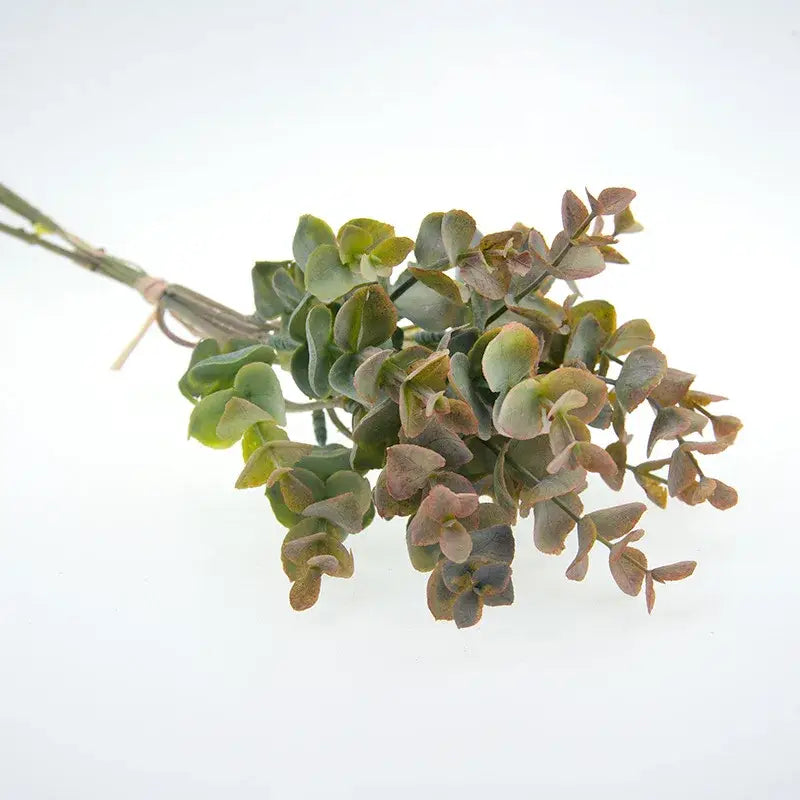 A bundle of peach and green decorbites eucalyptus leaves artificial tied with twine for living room vase decor