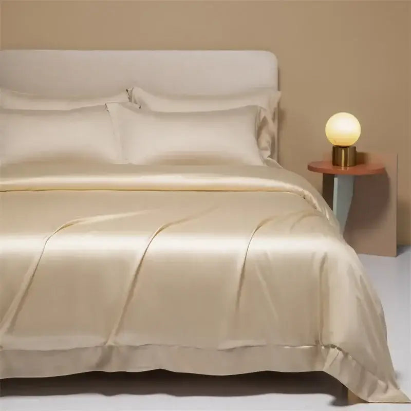 Cream-colored satin duvet cover with subtle ruffled edges in peach satin cooling cotton solid bedding set for bedroom