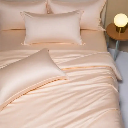 Cream-colored satin bedding set with smooth glossy finish in peach satin cooling cotton solid design for bedroom use