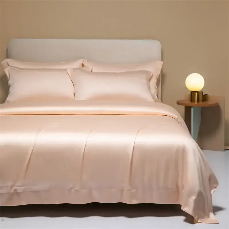 Peach satin cooling cotton solid bedding set with smooth glossy finish and elegant stitched detailing for bedroom