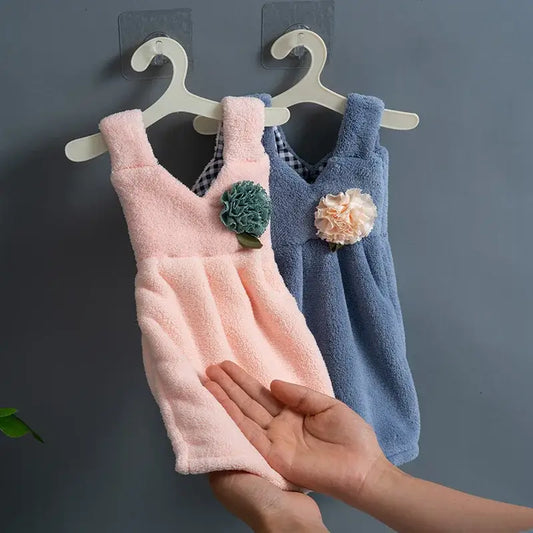 Pink and blue kids cute dress hand towels with floral embellishments hanging on white hangers for kitchen and bathroom decorbites hand towel