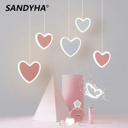 Pink and gray heart blossom butterfly led chandelier with white outlines and thin cords for bedroom lighting