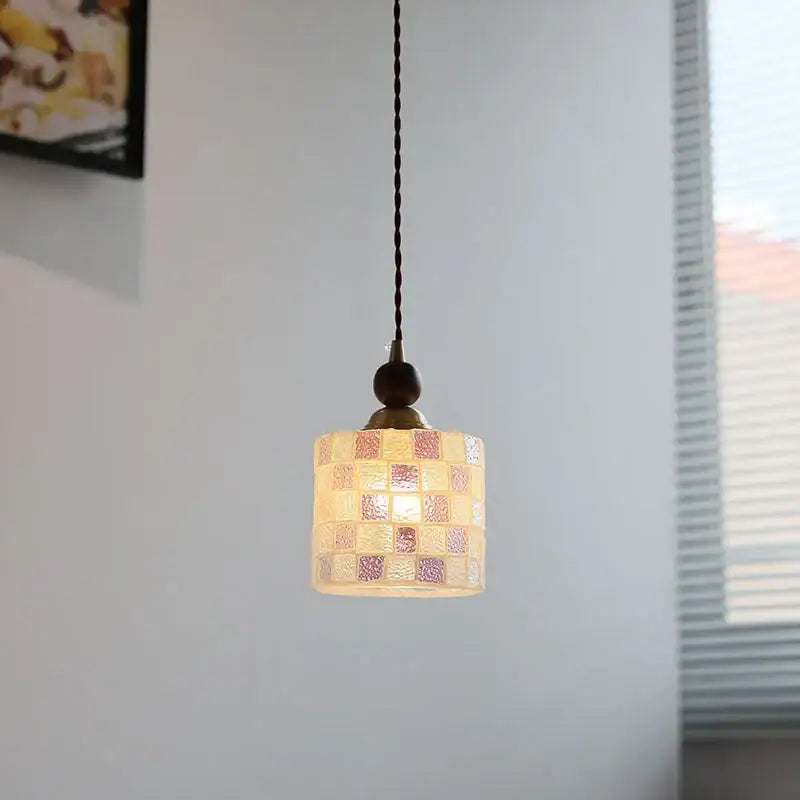 A warm-toned pink and lavender decorbites glass ball led pendant light with mosaic glass shade for kitchen decor