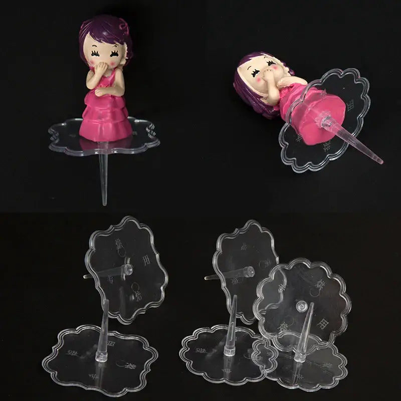 Pink and purple plastic doll cake stands decoration with purple hair on clear acrylic stand by decorbites cake stands