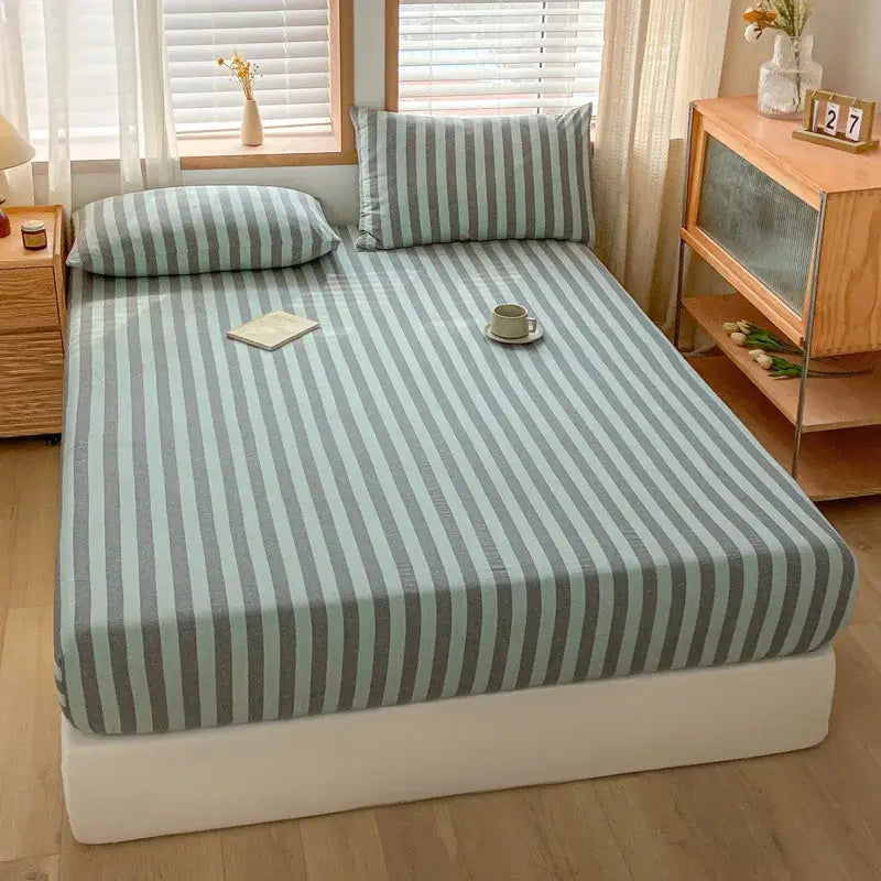 A soft light blue and gray cotton stripe fitted sheet with subtle texture decorbites cotton stripe bedroom cover