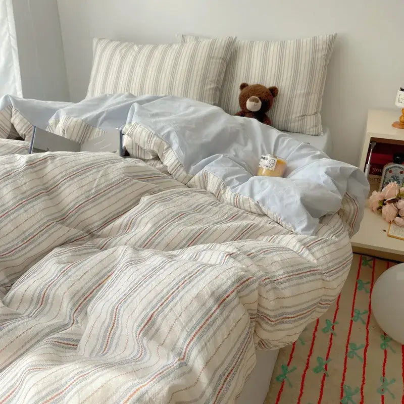 Cozy cotton grid duvet in cream with soft vertical red and gray stripes from decorbites cozy cotton bedding sets