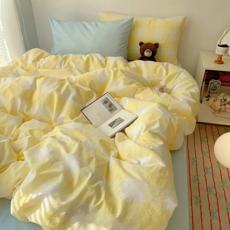 Soft yellow and white checkered bedding set with plush teddy bear in decorbites cozy cotton grid bedroom decor