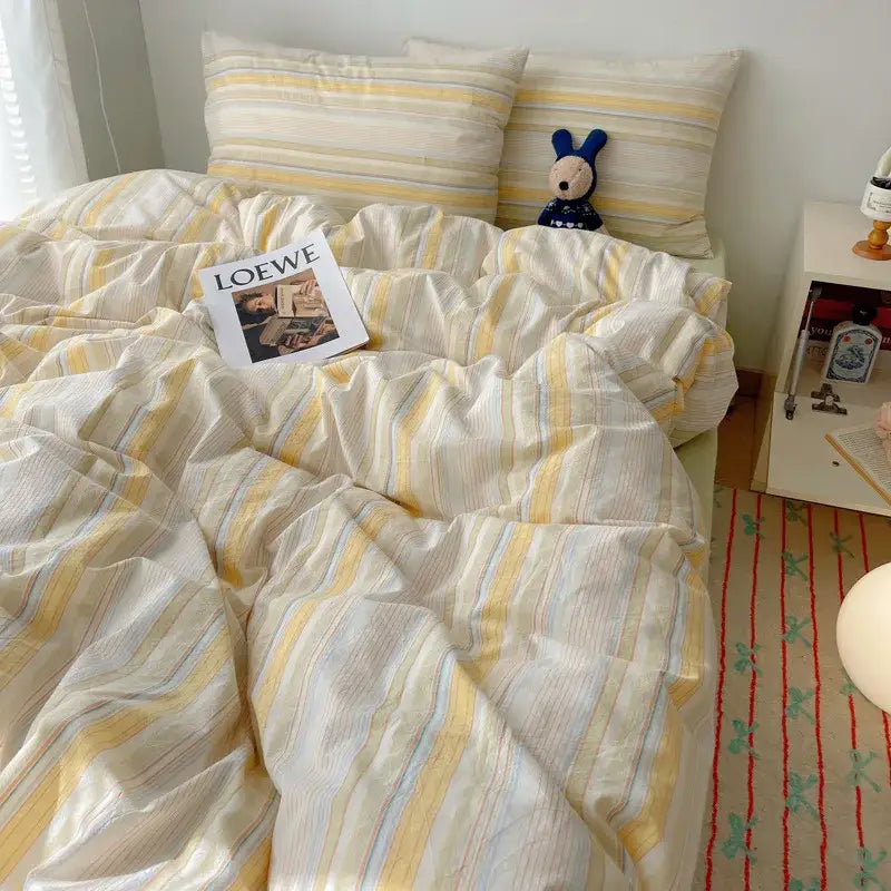 Soft cream and yellow striped duvet set with subtle blue accents from decorbites cozy cotton grid bedding sets