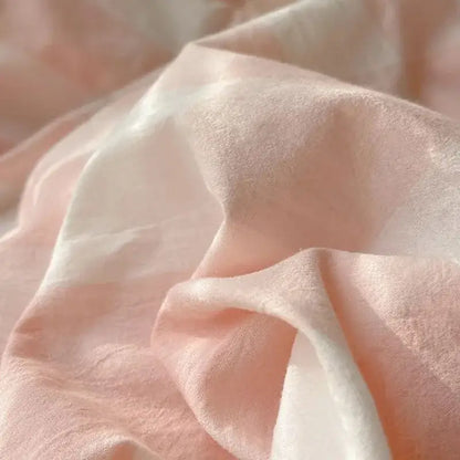 Soft blush-pink sheer fabric with lightweight texture and subtle sheen in decorbites cozy cotton grid bedding sets
