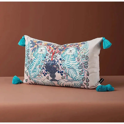 Rectangular pink and blue lion dog lumbar pillow cover with whimsical white bear embroidery and turquoise tassels