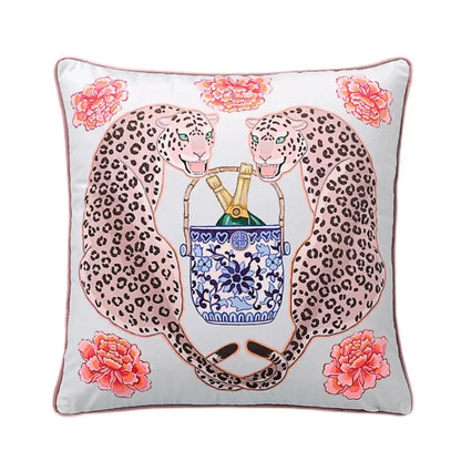 A square light gray fabric lumbar pillow cover featuring two pink leopard lion dogs holding a blue lion porcelain ice bucket