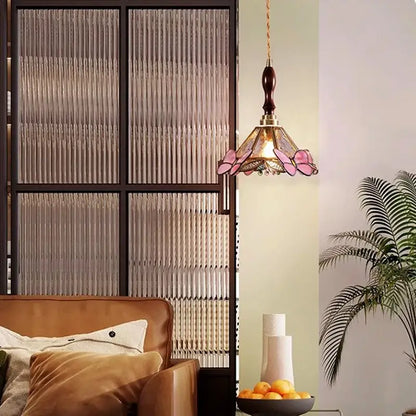 Delicate pink butterfly glass led pendant light with brass accents and dark wood finial for bedroom decorbites butterfly glass