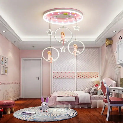 Pink cartoon princess kids room chandelier with led rings featuring glowing stars and suspended doll figures decorbites cartoon princess