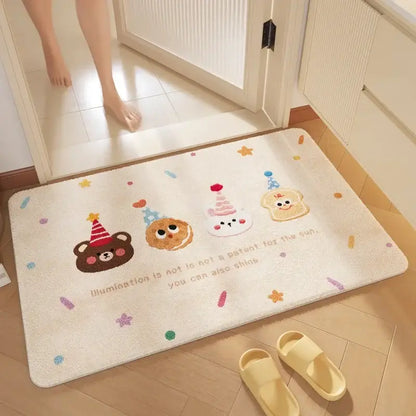 Cream-colored plush bathroom mat with soft absorbent fabric and decorbites cartoon print featuring festive party hats