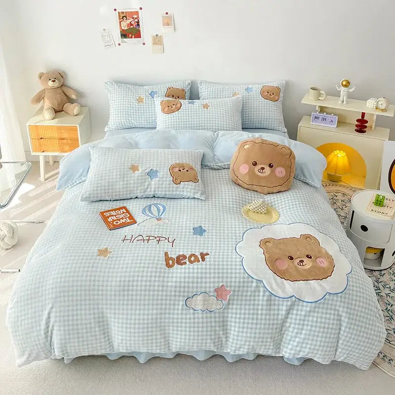 Light blue and white gingham bedding set with embroidered brown bear faces stars clouds and orange happy bear text decorbites cartoon rabbit applique
