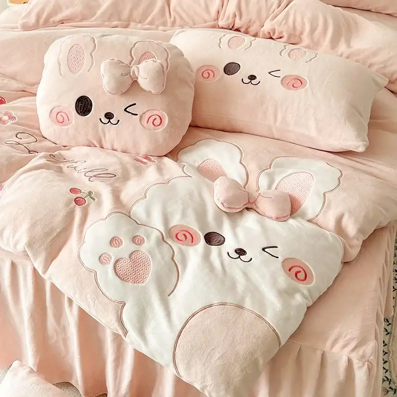 Pink cartoon rabbit applique bedding set featuring plush bunny faces and bows for bedroom comfort by decorbites