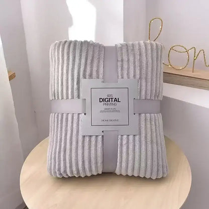 A soft light gray corduroy throw blanket with plush texture and vertical ribbed pattern for decorbites cozy striped decor