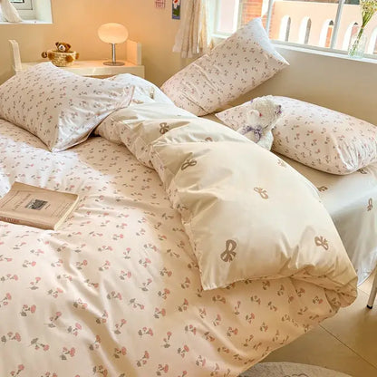Cream-colored floral bed set with delicate pink and green blossoms in soft cotton fabric from decorbites cotton cartoon printed collection