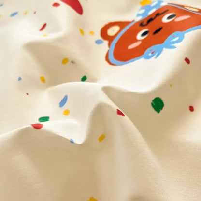 Cream-colored cotton cartoon printed bed set featuring a playful bear with blue outlines and pink cheeks decorbites cotton cartoon