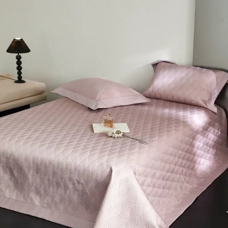 Soft pink diamond quilted cool lyocell fiber bedspread set with satin-like sheen for elegant bedroom decorbites use