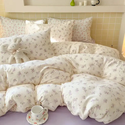 Cream-colored floral duvet bedspread set with soft quilted texture and delicate pastel flowers in double layer yarn