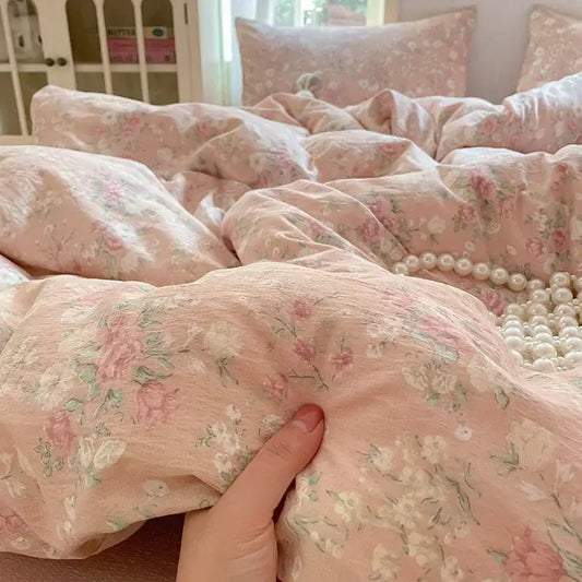 Pink floral double layer yarn bedspread set with delicate rose and green leaf patterns on soft textured fabric