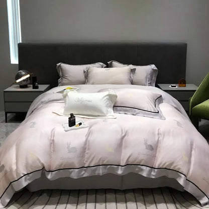 Soft blush pink satin duvet set with subtle rabbit embroidery and black piping in decorbites eucalyptus lyocell flowers