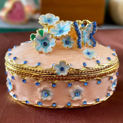 Pink floral heart jewelry trinket box with delicate enamel, gold trim, blue rhinestones, and turquoise accented flowers storage case