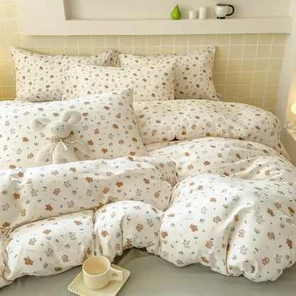 White fitted sheet set with soft cozy texture and brown teddy bear pattern for a comfortable bedroom setting