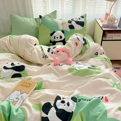 A cozy cartoon printed comforter set with cream fabric, black and white pandas, and green leaf patterns by decorbites cozy cartoon