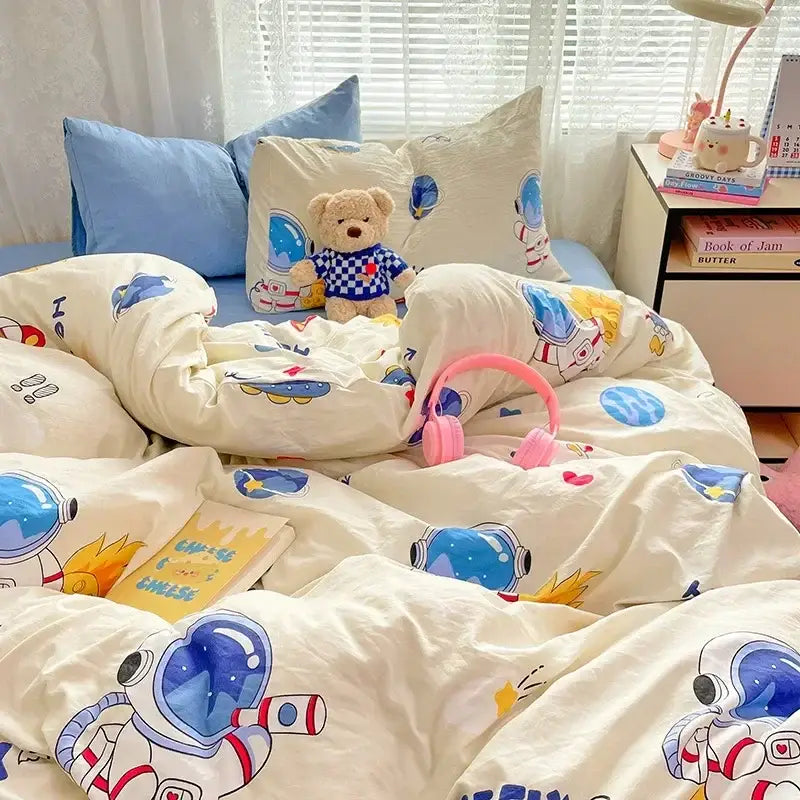Cream-colored cotton comforter set with astronaut-themed cozy cartoon printed decorbites cozy cartoon design