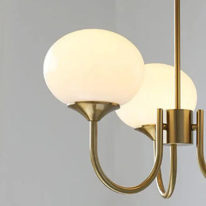 Brass-finished pendant lights with two frosted pink glass globe shades from decorbites designer loft pendant collection