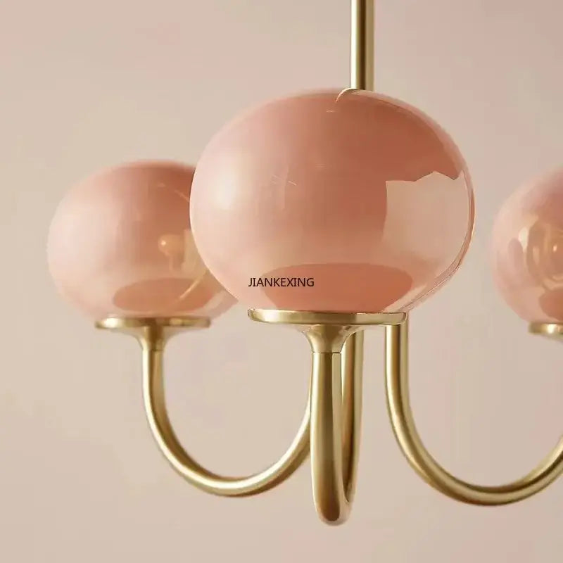 Pink glass globe designer loft pendant light with brass finish metal arms ideal for bedroom decorbites pendant lights