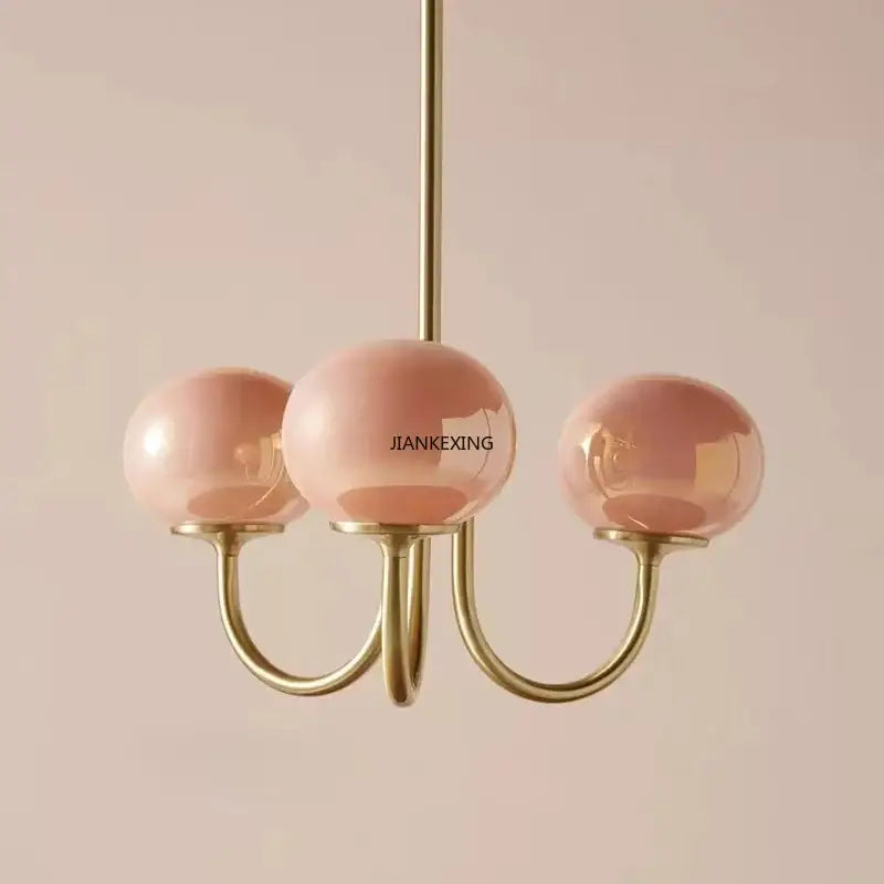 Delicate pink glass globe designer loft pendant lights with polished brass accents for bedroom decorbites designer loft