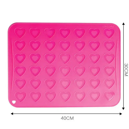 Pink heart silicone macaron baking mat with heart-shaped molds from decorbites for precise macaron baking