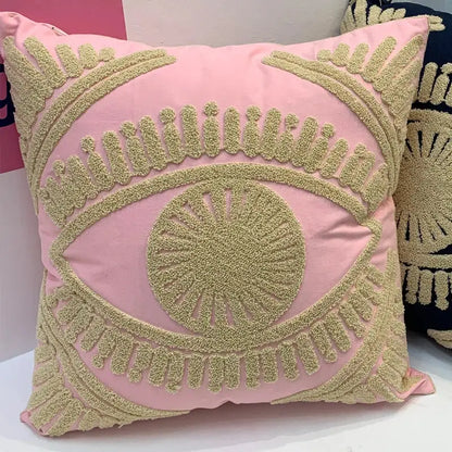 Pink cushion with textured gold embroidered eye design on cotton throw pillow cover for living room decor