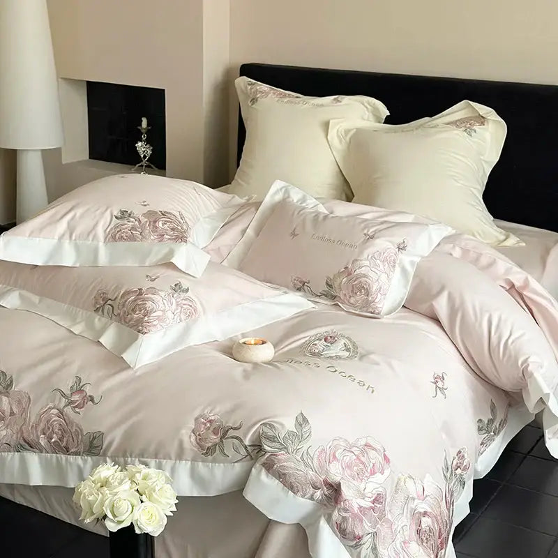 Pink floral embroidered satin bedding set with cream piping and delicate pink purple flowers in egyptian cotton design