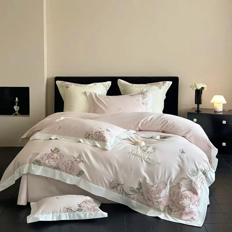 Pink and purple flowers embroidery bedding set in egyptian cotton with pink floral embroidery white piping and endless garden script detail