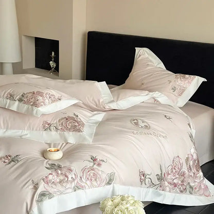 Pink floral embroidered satin bedding set with white piping and endless ocean text featuring pink purple flowers in egyptian cotton