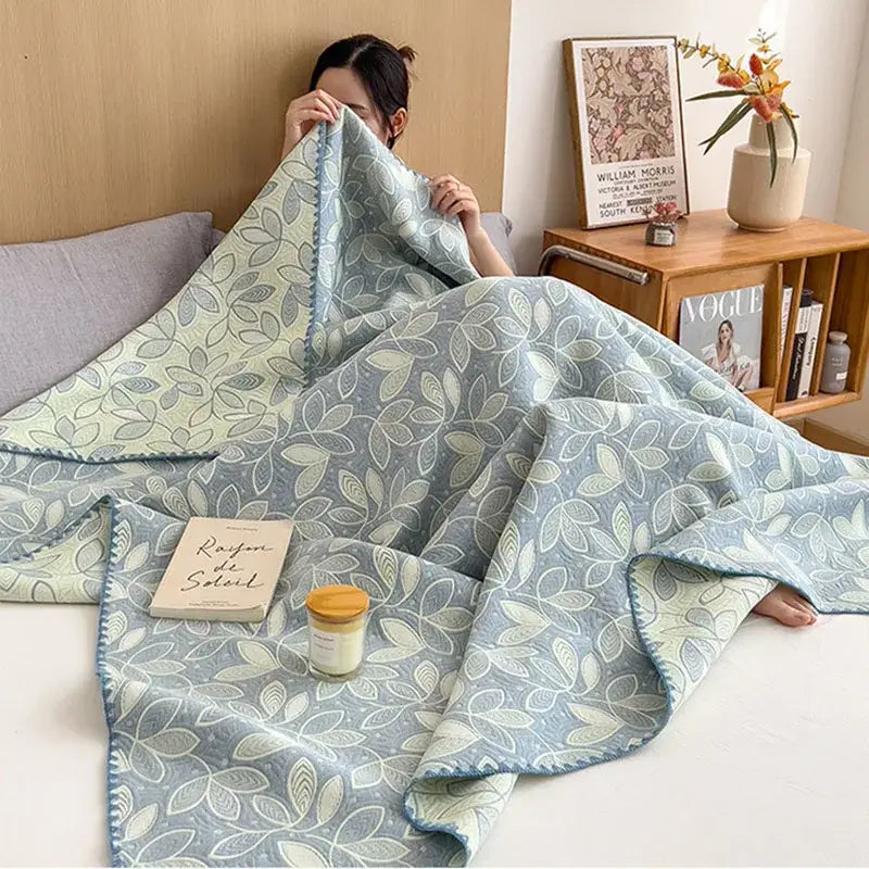 Pink ribbed teddy bear decorbites cotton towel blanket in soft light blue and cream with delicate leaf pattern