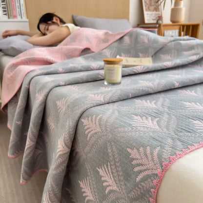 Gray and pink fern-patterned cotton towel blanket with lace trim from decorbites cotton towel collection for bedroom use