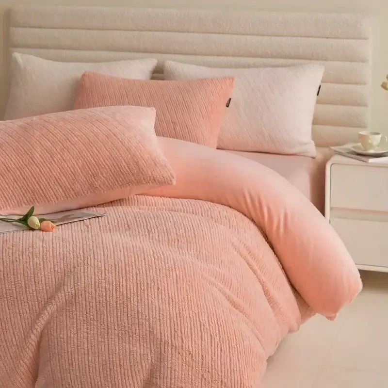 Soft pink corduroy winter fleece bedding set with textured duvet cover and matching pillows for bedroom use