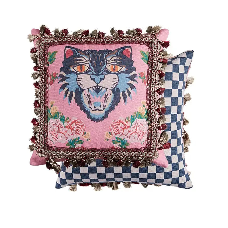 Pink velvet cushion cover with bold embroidered tiger cat print orange eyes blue fur floral pattern and tassels