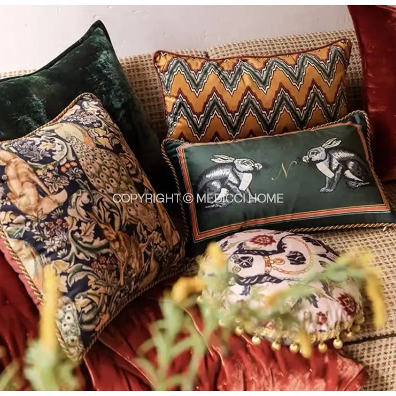 Dark green velvet cushion cover with embroidered white rabbits and gold-trimmed border for living room decor
